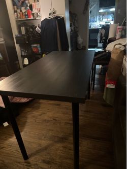Nice ikea table 4 ft long about 30 inch long screw on legs sturdy not meant to sit great for a desk temporary dinning table don’t need asking 25 in gr