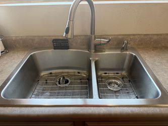 Stainless steel sink  and faucet included .. w 33