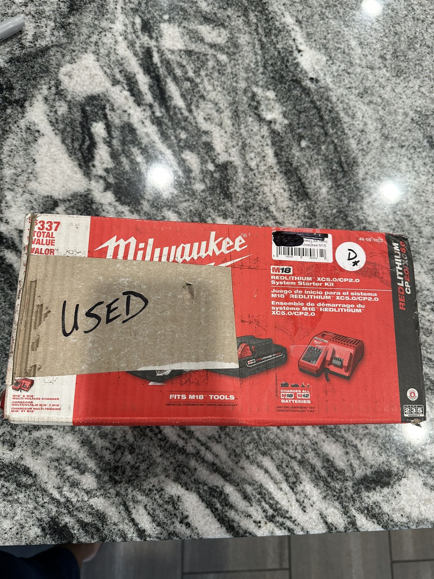 Milwaukee, red lithium M18/M12 charger and batteries kit.