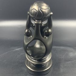 AFRICAN HAND CARVED SOAP STONE OF FAMILY  WITH A GLOBE