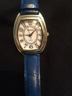 Gold tone blue band watch