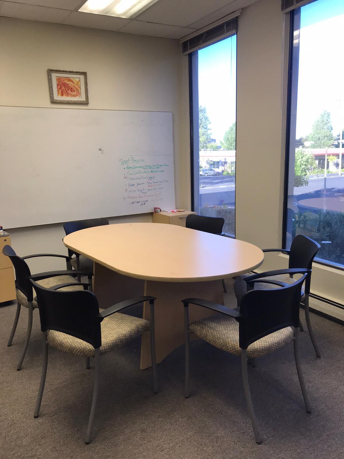 Oval conference table and ten chairs w arm rests