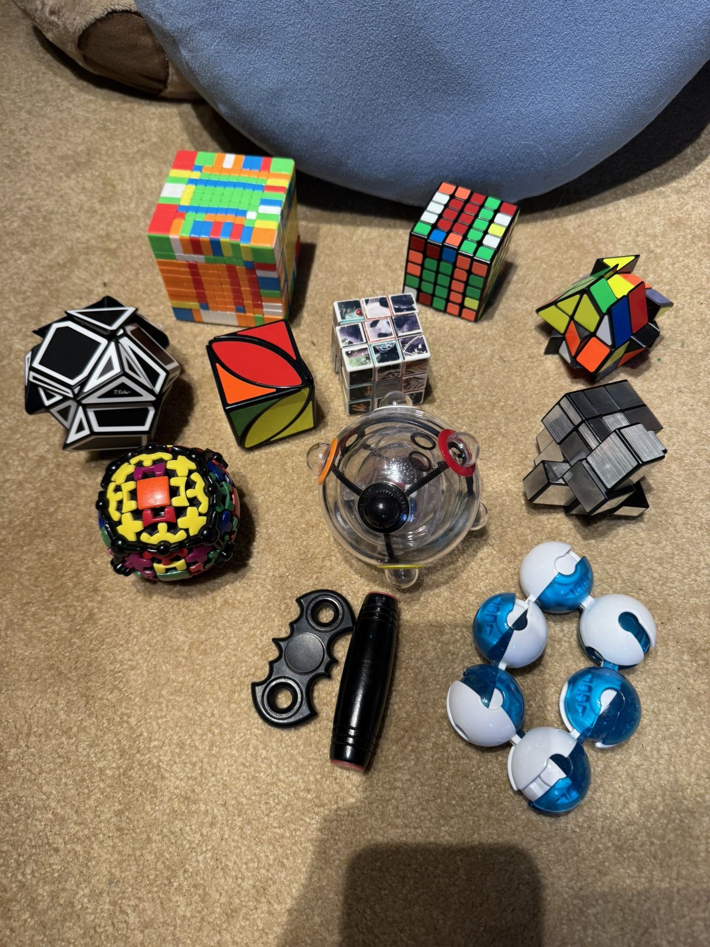 Set of rubik’s cubes , maze ball, fidgets, etc.