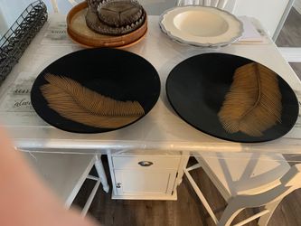 Two black wooden decoration plates