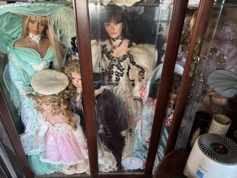 Porcelain Dolls And Cabinet