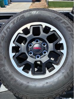 Near new BF Goodrich Trail-Terain T/A tires and Factory  24 Tacoma Rims