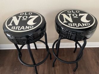 Pair of Jack Daniel’s backless bar stools.