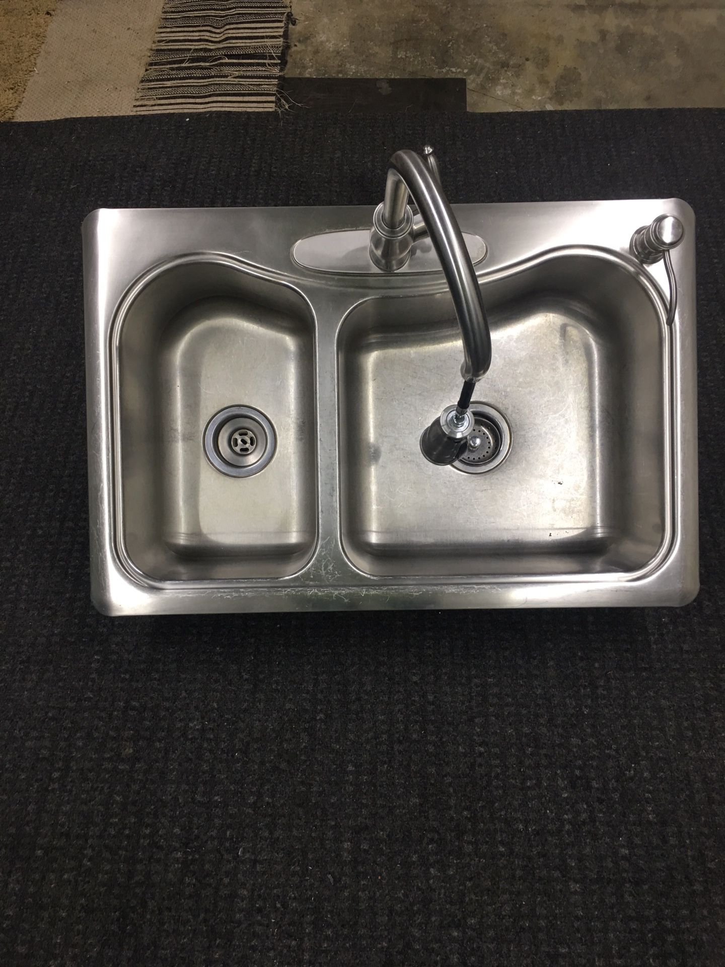 Kohler Stainless steel sink with faucet