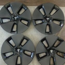 4 BRAND NEW TESLA HUB CAPS