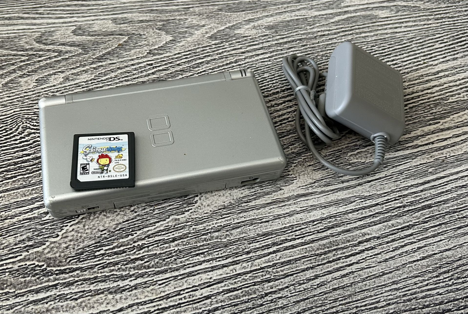 Silver Nintendo DS Lite with ScribbleNauts game, complete with charger. $65