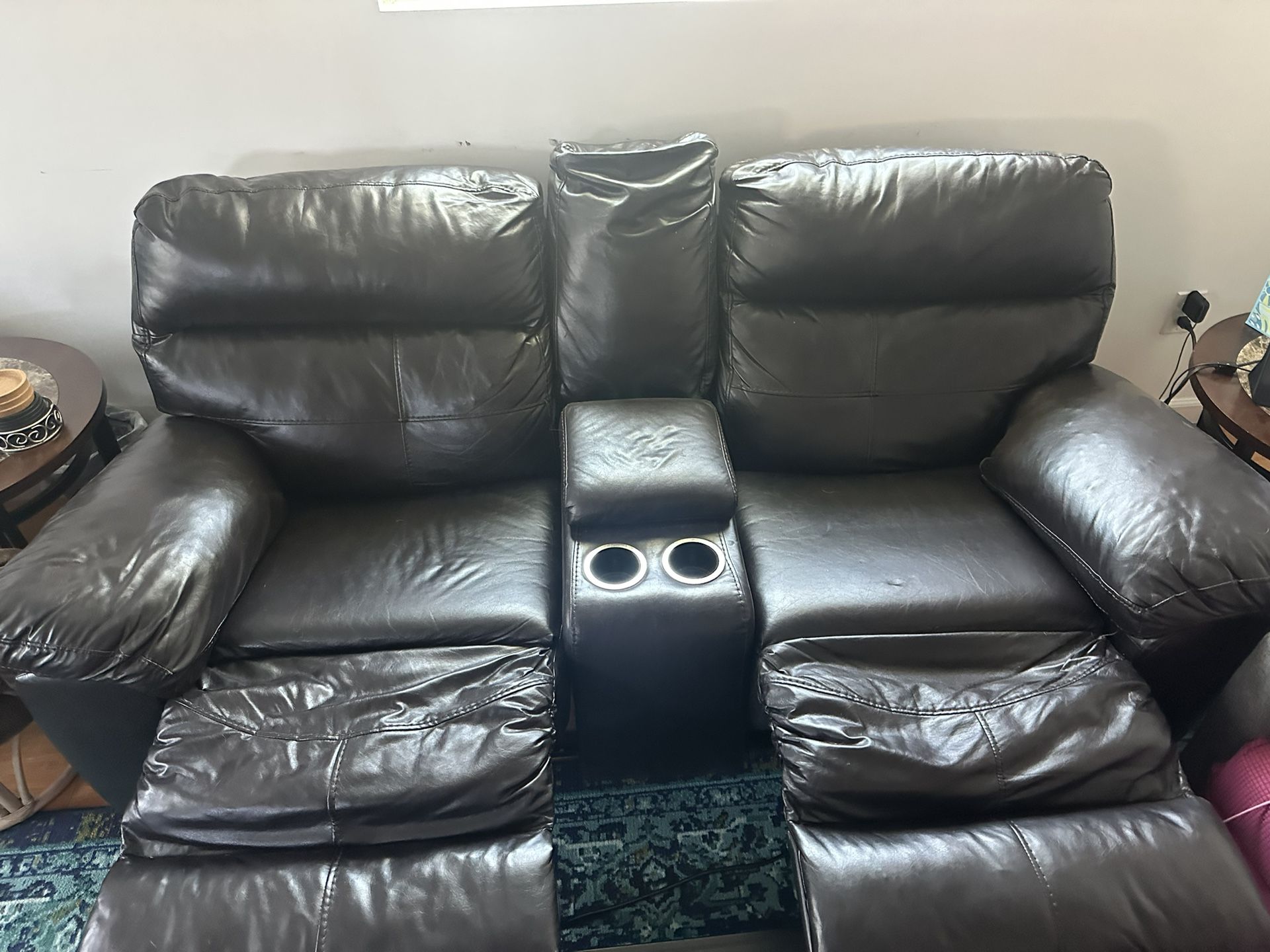 2 seat leather couch with center console & 2 leg rests