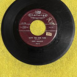 This item is a vintage Jerry Wallace 45 RPM vinyl record titled "How The Time Flies", released on Challenge Records (catalog number 59013) in 1958. 