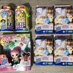 KIT Baby Alive w two Foodie Cuties + doll Glo Pixies Sugar + four boxes with four dool diapers - NEW