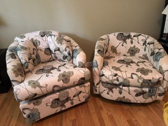 Two upholstered swivel chairs