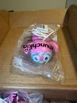 pink Munchkin Wind Up Swimming Penguin bath toy still sealed in its packaging.