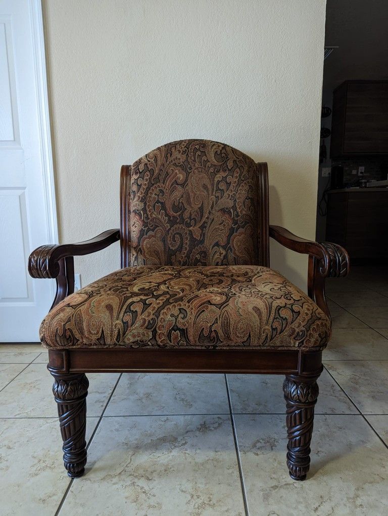 Wooden Chair With Beautiful Carving On Armrests And Legs . And Side Tables With Beautiful Carving Dying On It.
