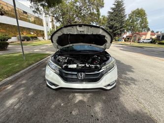 Vendo bonita camioneta Honda CRV título salvaje 108,000 millas