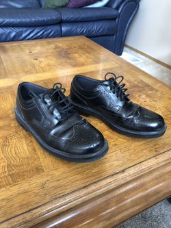 Black wingtip shoes