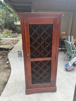 Wood wine cabinet jailhouse door
