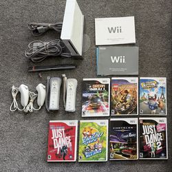 Nintendo wii bundle 7 games 2 controllers storage tower