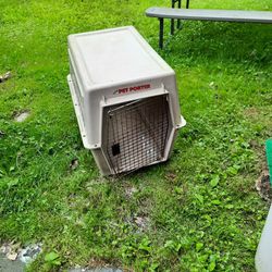 Large dog crate and  Is baby surrounding baby gate