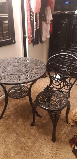 Table and chair (cast iron)