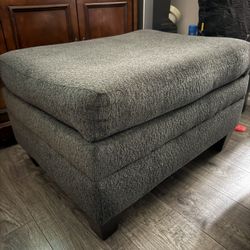 Two Dark Grey Ottomans