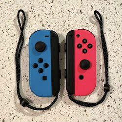 Nintendo Switch Neon Red & Neon Blue Joy-Cons with Black Wrist Straps (PREOWNED)