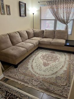 L- shape sectional couch - and TV with tv stand.