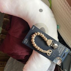 Pacifier holder and tummy time pillow