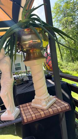 This is a vintage Mexican spiral column pedestal plant stand made of plaster