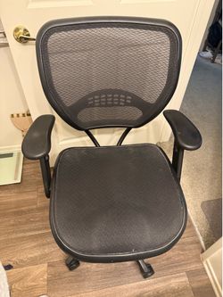 Adjustable mesh office chair on wheels