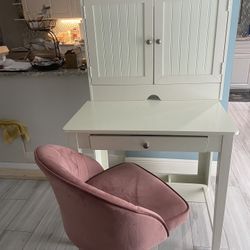 Small unique desk, and perfect pink velvet chair