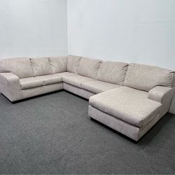Ashley Light Beige Sectional with right facing Chaise. We deliver & setup.