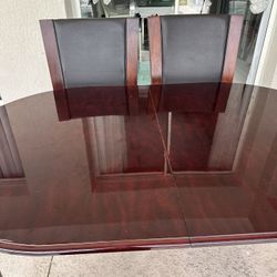 Wooden dining table and chairs