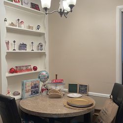 Round table and faux leather chairs