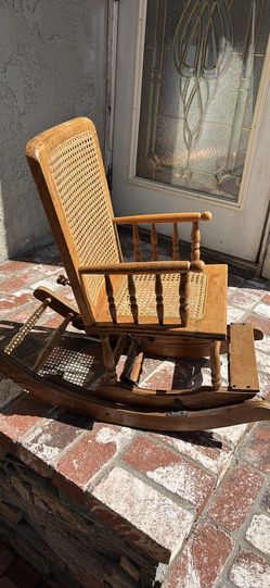 Charming wood OAK cane rocking chair. Has nice woven back and seat. Good for a kiddo or just for decor.