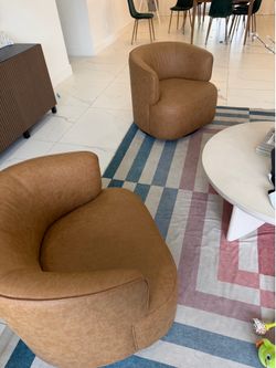 2 camel swivel chairs PERFECT CONDITION!!