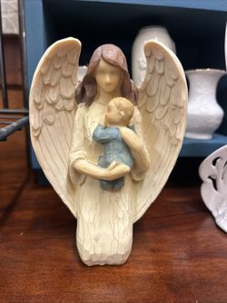 Vintage Angel Holding Baby