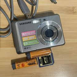 Samsung SL30 digital camera 10.2 Mp Tested Works  Flash zoom video shutter all working. Batteries, memory card and USB cord included