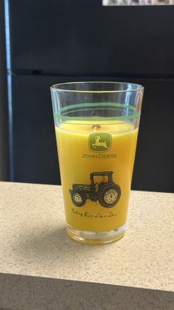Yellow Wood Wick Candle In a John Deere Nothing Runs Like A Deer Container.
