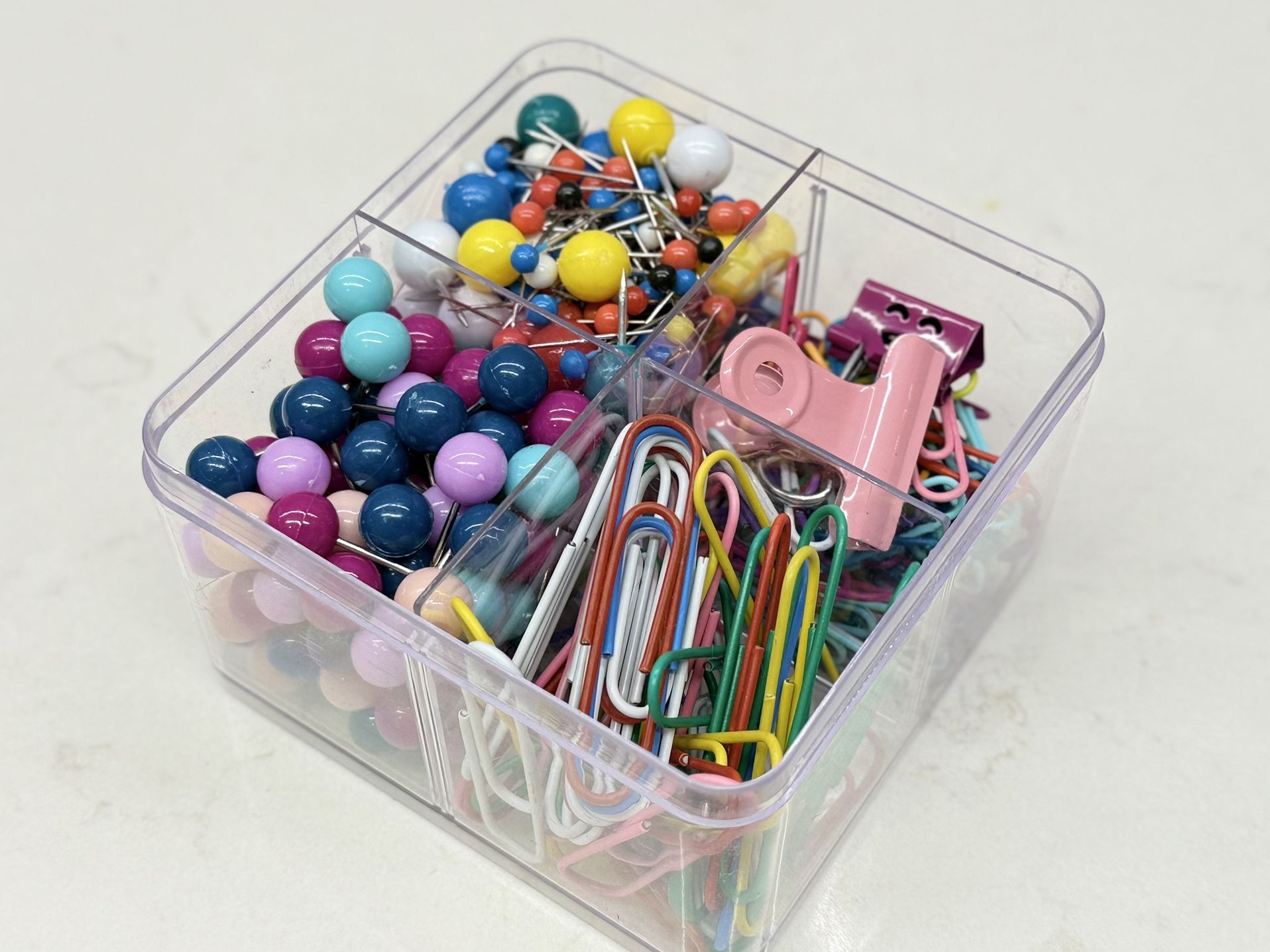 Office supplies- push pins, paper clips, map pins, etc