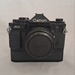 Canon A-1 Black Perfect w/autowinder, 50 mm 1.8 lens, bag, and accessories *TESTED* Apopka Pick-Up 