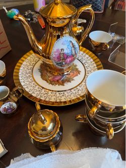 Large box of golden style tea and plates