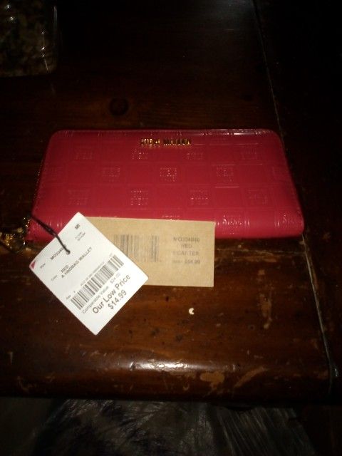 Steve Madden wallet with strap handle.