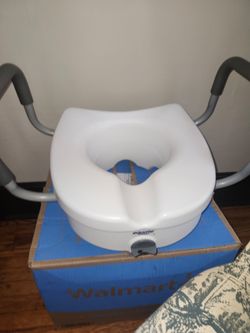 Raised toilet seat