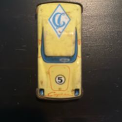 This is a vintage yellow Strela tin toy race car.  Soviet Era 1976