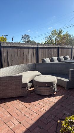 Gray outdoor wicker sectional with ottoman