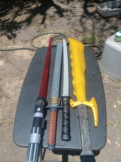 !! 4 Toy Swords  Price For All