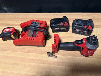 Milwaukee Impact Drill, 2 batteries, charger, 25’ measuring tape